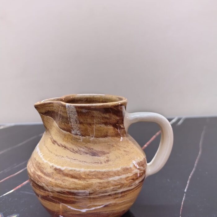 Vintage agate ware marbled studio pottery jug with turquoise blue inner.